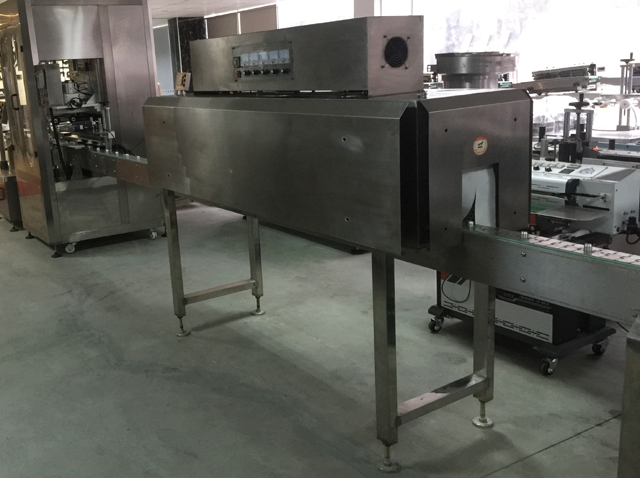 caps sealing line shrinking.jpg