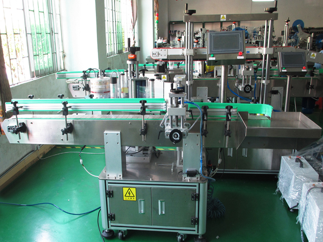 labeling machine with positioning system LABELING EQUIPMENT BOTTLES PLC.jpg