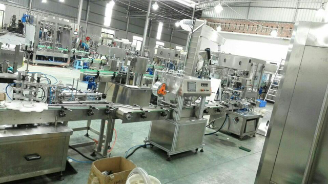 jars filling line in factory.jpg