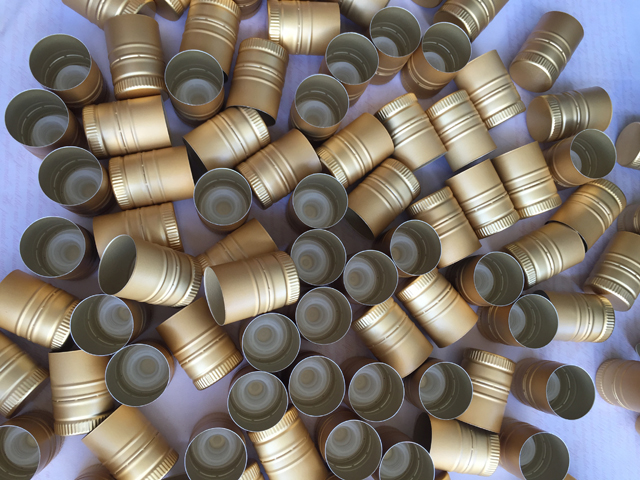 caps samples sent from usa customer for capping machine aluminum caps.jpg