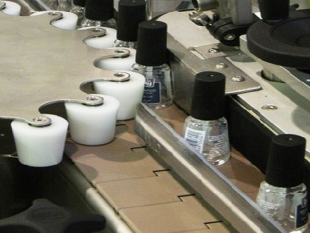 bottles with rotary star wheel for labeling.jpg