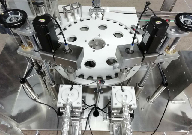 bottles robot arm feeder.jpg