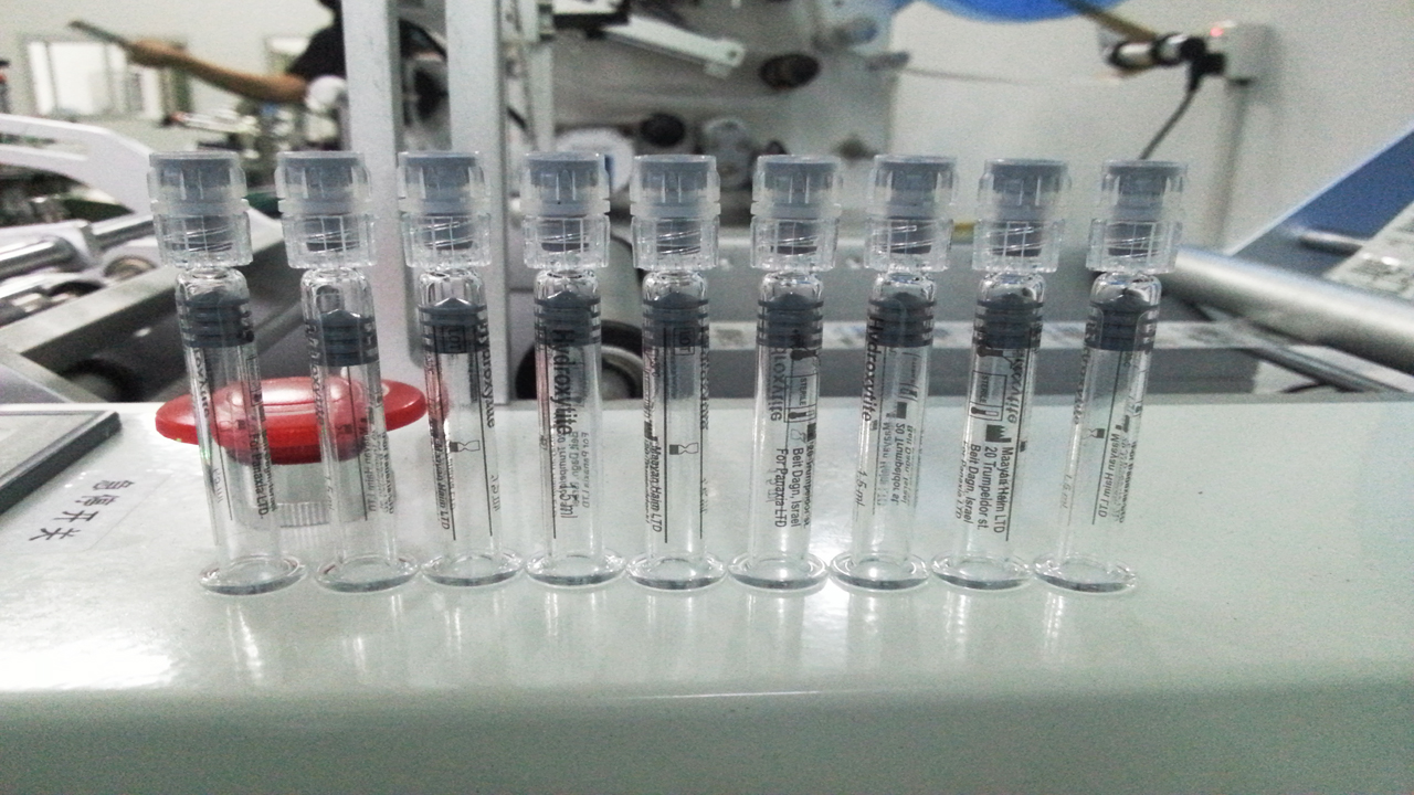 labeling machine semi automatic touch screen for syringes.jp