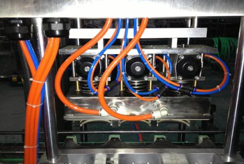 vacuum capping heads part close shot.jpg