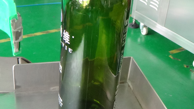 red wine bottles close shot on the joint line.jpg